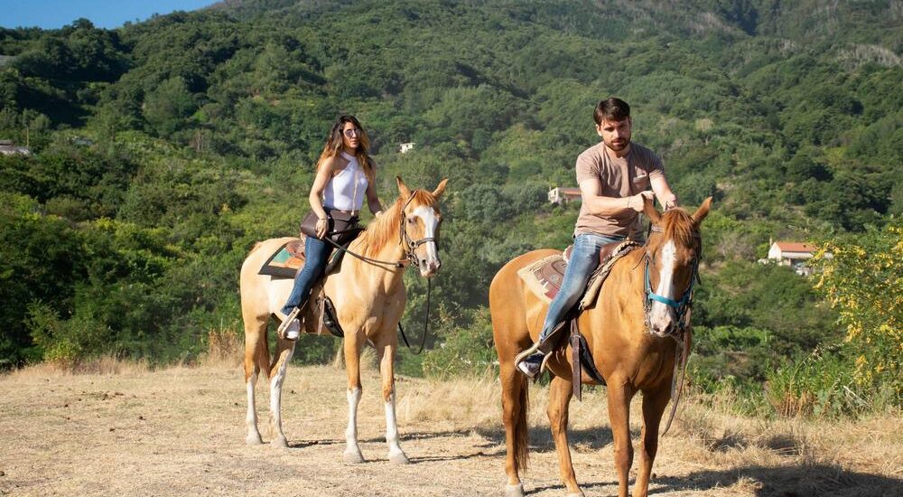 Couple riding horse in the Vesuvius National Park