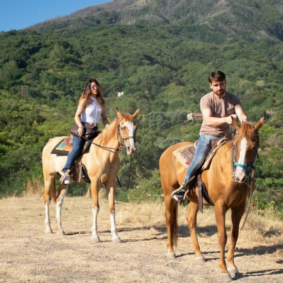Couple riding horse in the Vesuvius National Park