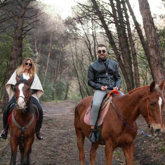 People riding horse in the woods of Vesuvius National Park