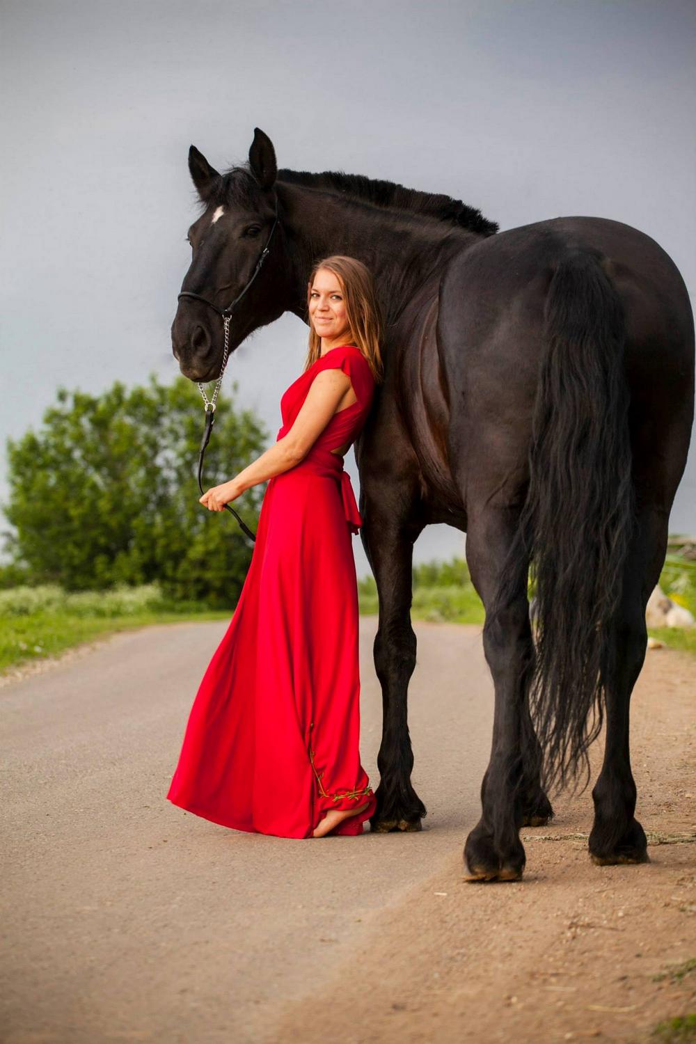 Photo shooting in the Vesuvius National Park with beautiful girl with red dress and black horse