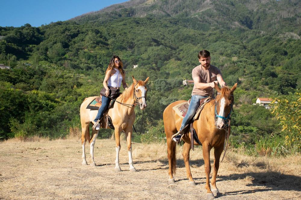 Couple riding horse in the Vesuvius National Park