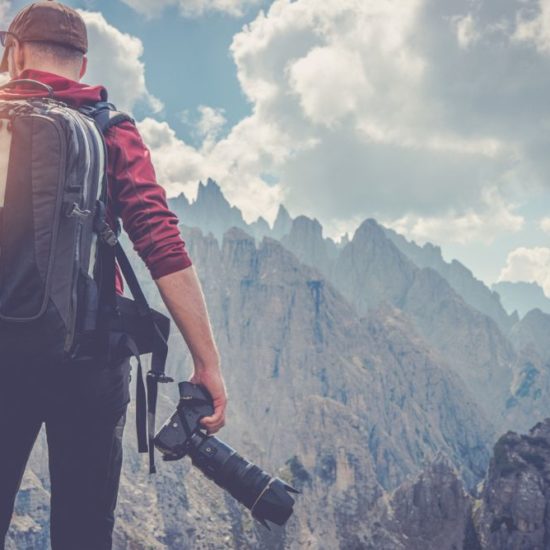 Travelling photographer looking to the scenary