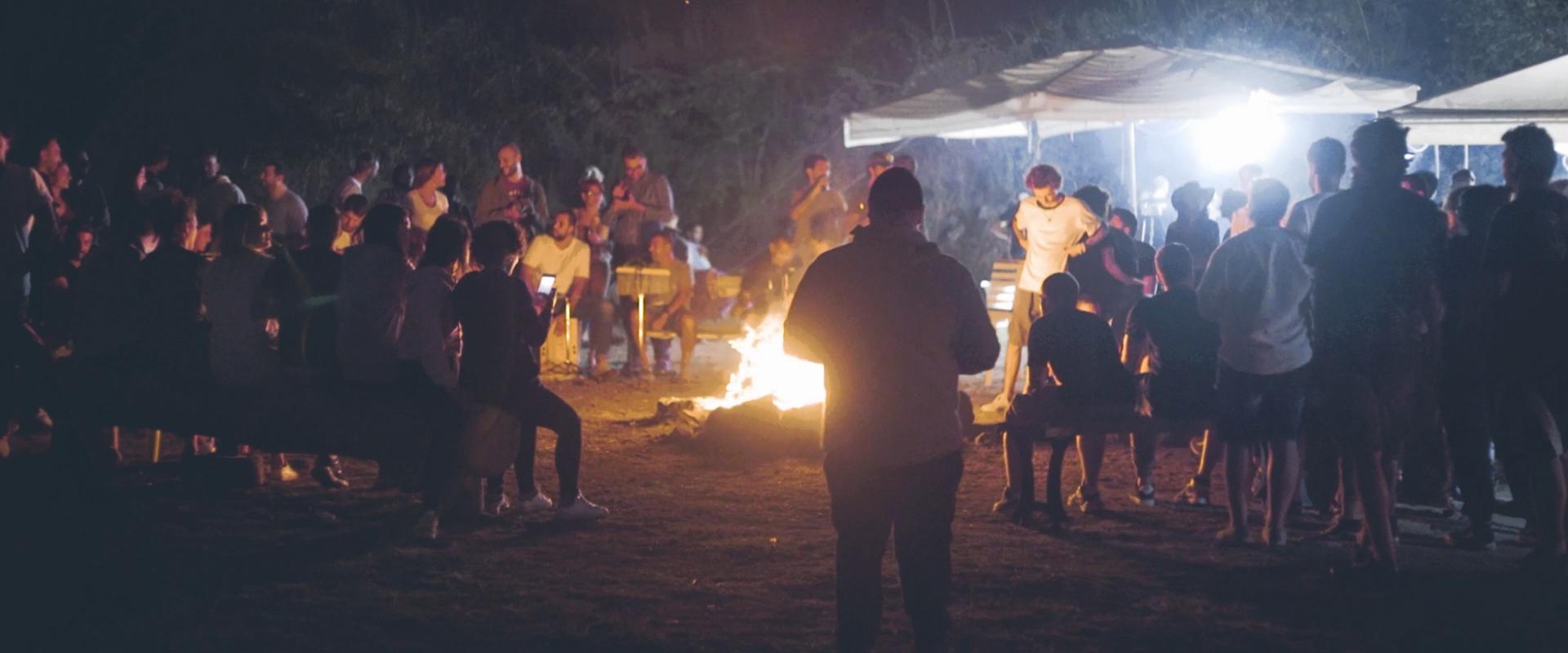 bonfire surrounded by people